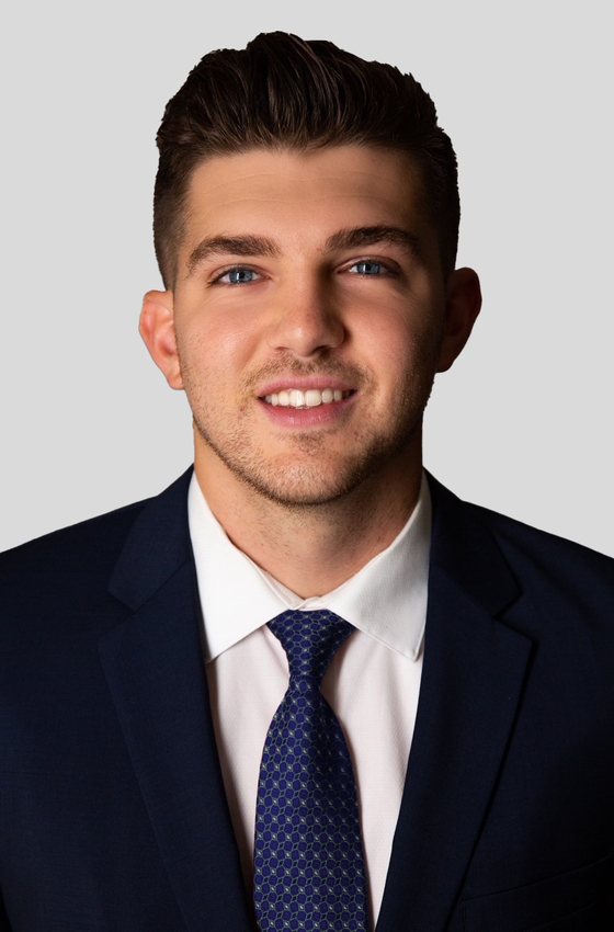 Portrait of Arian Hoxha, Licensed Real Estate Advisor.